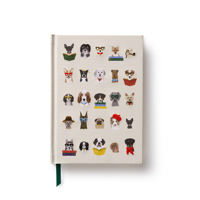 The Studious Dogs Embroidered Journal by Rifle Paper Co. features a cream cover with embroidered illustrations of various dog breeds, each wearing glasses and holding books or newspapers—an adorable and unique keepsake.