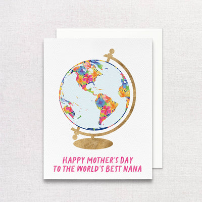 Gert & Cos Mothers Day card features a globe with continents in colorful floral patterns on a gold stand. Happy Mothers Day to the Worlds Best Nana is written in pink text. Crafted on recycled paper by a woman-owned company, its set against a neutral background.