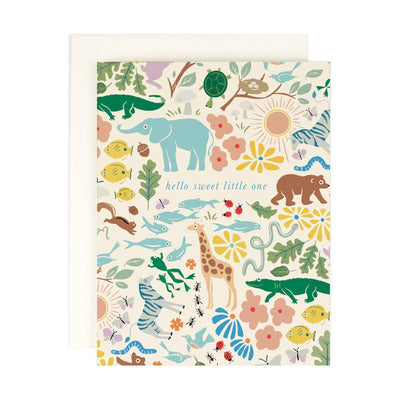 The Amy Heitman Sweet Little One Baby Card features colorful animal and plant illustrations on warm white cover paper, a “hello sweet little one” greeting, a coordinating envelope, and a blank interior for your message.