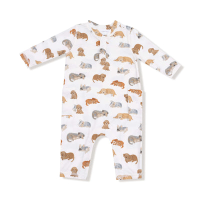 The Napping Puppies Uni Romper by Angel Dear is a white long-sleeve romper featuring playful brown, gray, and tan puppy illustrations, crafted from soft bamboo viscose for ultimate comfort.