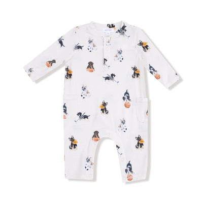 The Sporty Puppies Uni Romper by Angel Dear is a white long-sleeved romper with playful puppy basketball prints, made from soft bamboo and spandex. Features front buttons and two side pockets.