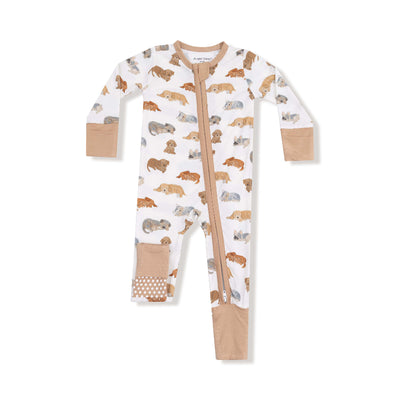 The Angel Dear Napping Puppies Two-Way Zipper Romper features a white background with brown and beige puppy prints, solid tan fold-over cuffs and feet, and a front zipper that extends down one leg for easy dressing.