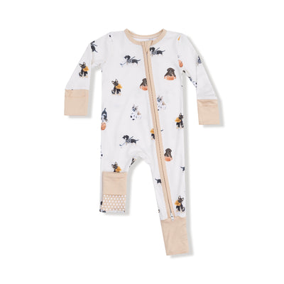 The Sporty Puppies Two-Way Zipper Romper by Angel Dear features playful dog illustrations, beige fold-over cuffs and trim, and a diagonal bamboo zipper from neck to leg.
