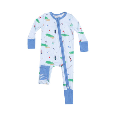 The Golf Things Blue Two-Way Zipper Romper by Angel Dear is a light blue romper made from bamboo fiber for sensitive skin, featuring golf-themed illustrations such as clubs, balls, and flags. It has a front zipper with blue trim and cuffs, along with patchwork detail.