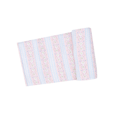 The Ogee Floral Muslin Swaddle Blanket by Angel Dear features a folded piece of organic cotton fabric with pastel stripes and floral patterns in pink, blue, and white, complete with hand-drawn wavy, lace-like details for a delicate look.