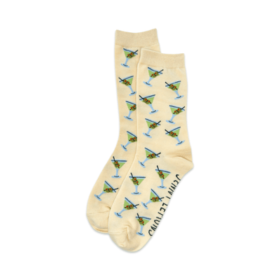 Jenny Lemons' Martini Crew Socks feature a beige design with martini glasses and green olives, plus “GIN & TITTIES” printed on the sole—perfect for cocktail lovers seeking playful style.