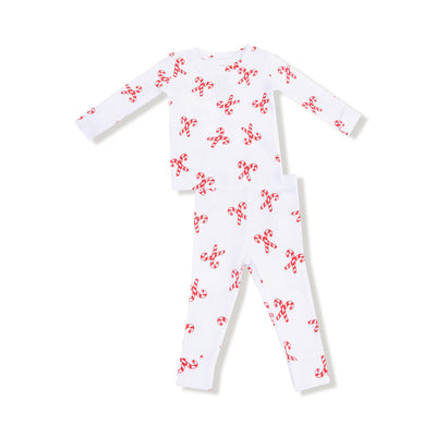 The Candy Canes Loungewear Set by Angel Dear features children's white long-sleeve top and matching pants, both adorned with festive red candy cane prints and laid flat on a white background.