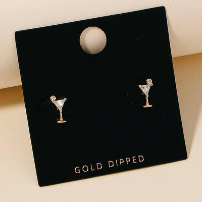The Fame Accessories Gold Dipped Cz Martini Glass Stud Earrings feature sparkling cubic zirconia stones and come displayed on a black card labeled GOLD DIPPED.
