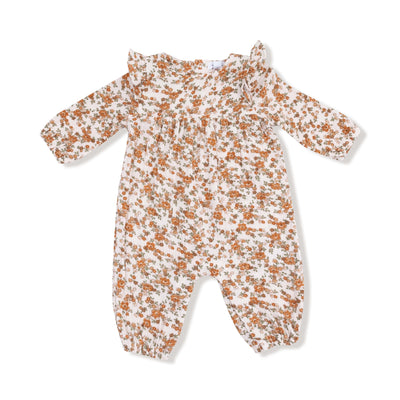 The Prairie Calico Ruffle Sleeve Romper by Angel Dear features soft organic cotton muslin, a white base with brown and orange floral print, ruffled shoulders, gathered cuffs, and elastic ankles for adorable comfort.
