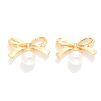 gold metal bow and pearl post earrings