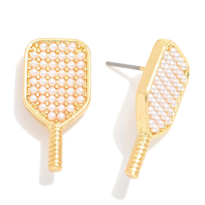 The Pearl Pickleball Racquet Earrings by Judson & Company are gold-tone studs shaped like paddle rackets, each 1 long and adorned with small white pearls.