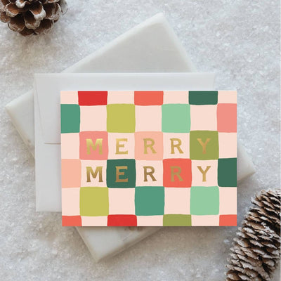 Idlewild Co.'s Merry Merry Checks Holiday Greeting Card (boxed set of 8) features a colorful checkered design with "MERRY MERRY" in gold and green letters, gold foil detail, and comes with matching envelopes.
