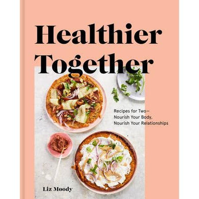 The cover of Healthier Together by Penguin Random House LLC features two colorful dishes with greens and veggies on a pink background. Its subtitle: Recipes for Two – Easy Recipes to Nourish Your Body, Nourish Your Relationships.