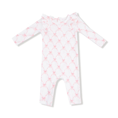 The Ribbon Bow Trellis Ruffle Sleeve Romper by Angel Dear features white bamboo viscose, pink bow print, ruffled shoulders, and footless legs. Machine washable on gentle cycle. Shown against a plain white background.