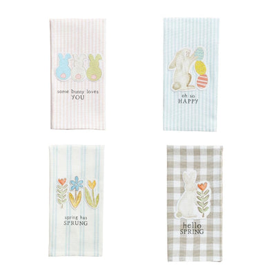 Four Easter Patch Towels by Mud Pie are beautifully displayed. These canvas hand towels showcase pastel colors with appliqued designs of bunnies, eggs, flowers, and charming phrases: some bunny loves you, oh so happy, spring has sprung, and hello spring.