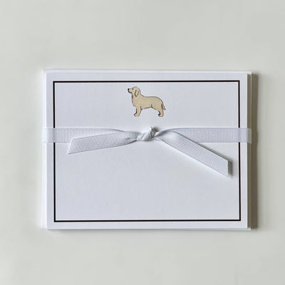 A set of Golden Retriever flat note cards by Georgetown Paperie on ultra-white paper, elegantly tied with a white ribbon. Each card has a small illustration of a light brown dachshund at the top center, outlined by a thin black border.