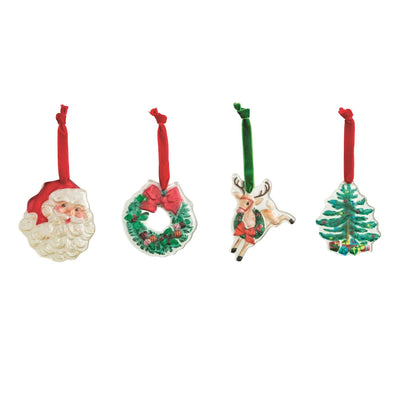 The Mud Pie Classic Christmas Glass Ornaments set includes four hand-painted ornaments—Santa head, wreath with red ribbon, reindeer with green ribbon, and a decorated tree—all with velvet hangers.
