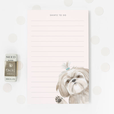 The Dear Hancock Shihtz to Do- Notepad features lined paper, a Shih Tzu with a blue topknot, and confetti dots. Made in the USA, its perfect for cute stationery fans and comes with a gold SEED eraser.