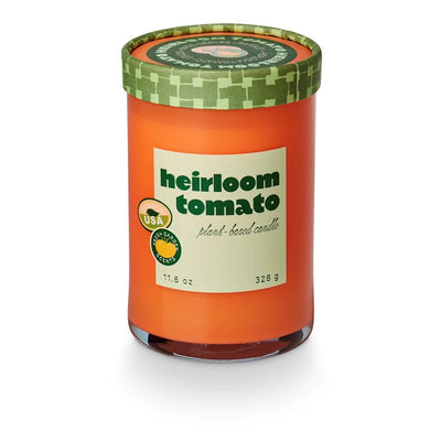 orange candle with heirloom tomato label and green pattern lid