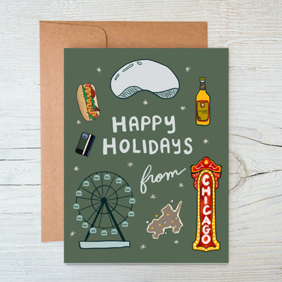 The Chicago Favorites Holiday Card by Marigold Press features illustrations of iconic attractions—Ferris wheel, Bean, hot dog, liquor bottle, deep-dish pizza, transit card, and Chicago sign—with “Happy Holidays from Chicago” text.