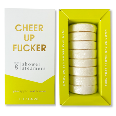 A white and yellow Chez Gagné box labeled Cheer Up Fucker holds 8 phthalate-free pineapple lemon aromatherapy shower steamers, with Turn that frown upside down on the side.
