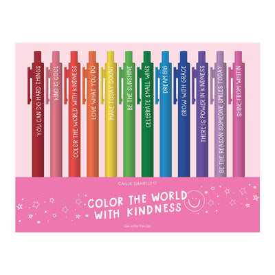 A row of colorful gel ink pens from the Color The World With Kindness Pen Set by Callie Danielle features uplifting messages like You can do hard things, Kind is cool, and Dream big. The packaging cheerfully states, Color the World with Kindness with a smiley face.