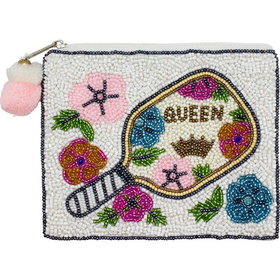 The Pickleball Queen Beaded Coin Purse by Judson & Company is a fully lined 100% cotton bag featuring a beaded paddle, QUEEN, crown, colorful flowers, and a zipper finished with two pink pom-poms.