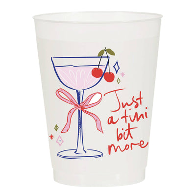 Sip Hip Hooray’s Just a Tini Bit More Frosted Cups (pack of 6) feature a cocktail glass with a red bow and cherries, plus red handwritten text. Durable 16oz cups, ideal for tailgate parties with lasting high-quality print.