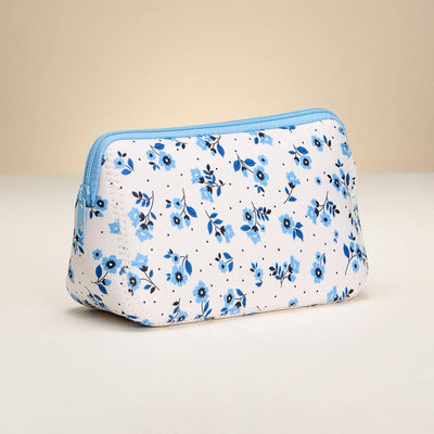 The Sensibling Corp. Flower Pattern Cosmetic Pouch is a white rectangular bag with a blue zipper and small blue flowers, shown against a neutral background.