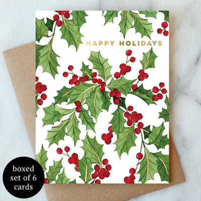 The Vines of Holly Holiday Cards by Abigail Jayne Design feature watercolor holly and gold foil "HAPPY HOLIDAYS" text. Comes as a box set of 6 with brown envelopes.