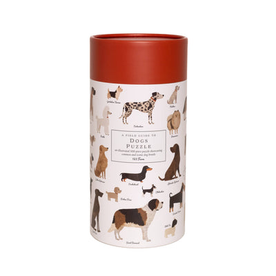 The 123 Farm Dogs Puzzle – 500 Pc Tube features vintage illustrations of various dog breeds, each labeled by name. Packaged in a cylindrical box with a red lid, this puzzle offers a beautifully detailed field guide to dogs.