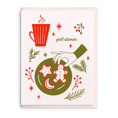 The Girl Dinner Letterpress Christmas Card by Dahlia Press features a whimsical hand-illustrated scene with a gingerbread cookie, festive plate, holiday foliage, a red mug, and "girl dinner" in the center—perfect for the holidays.
