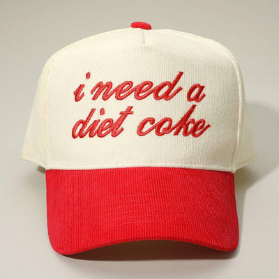 The Sensibling Corp. I NEED A DIET COKE Embroidered Corduroy Baseball Cap is a white and red 5-panel hat with I NEED A DIET COKE stitched in red cursive on the front.