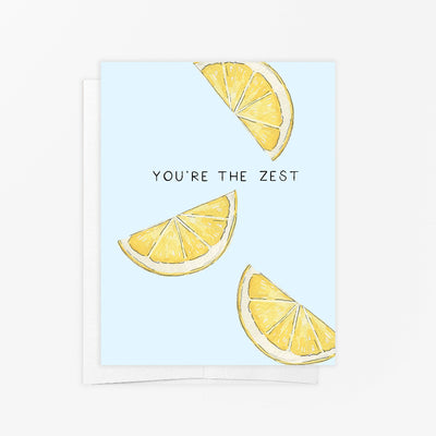 The Youre The Zest Greeting Card by emmy+olly is an eco-friendly card with three lemon wedges on a light blue background and YOURE THE ZEST in bold black letters at the center.