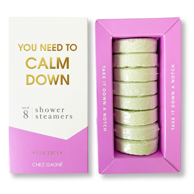 Chez Gagné’s You Need to Calm Down - Shower Steamers - Eucalyptus features 8 light green eucalyptus aromatherapy steamers, infused with essential oils, arranged in a pink and white box with gold lettering.
