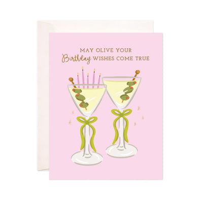 The Olive Your Wishes Greeting Card by Bloomwolf Studio features two martini glasses with olives, green ribbons, and pink birthday candles. It reads May olive your birthday wishes come true and has a blank interior for your message.