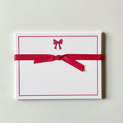 flat notecards tied in pink bow with pink bow at top of card