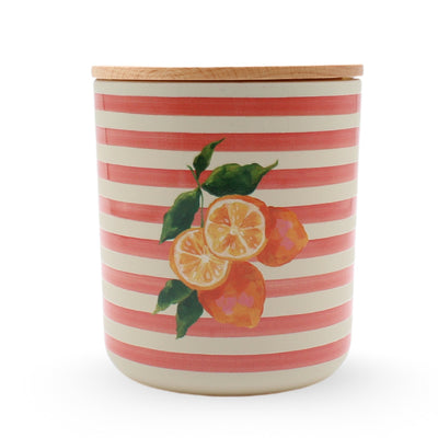 The ROAM Homegrown Riviera Luxe Candle in Jasmine Citron comes in a ceramic jar with pink and cream stripes, lemon and leaf design, a flat wooden lid, and offers up to 60 hours of burn time.