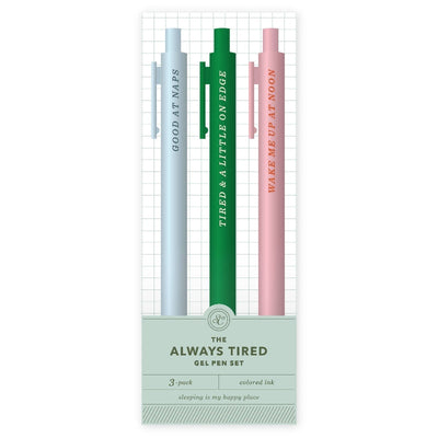 The Always Tired Pen Set by Studio Calico includes three funny gel pens in blue, green, and pink, each with a quirky phrase—making it a perfect gift for students who love humor in their stationery!.