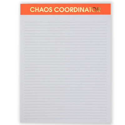 The Chaos Coordinator - Large Memo Lined Notepad by Chez Gagné features bold orange and gold lettering. It offers FSC-certified thick pages with evenly spaced lines, perfect for jotting down your thoughts.