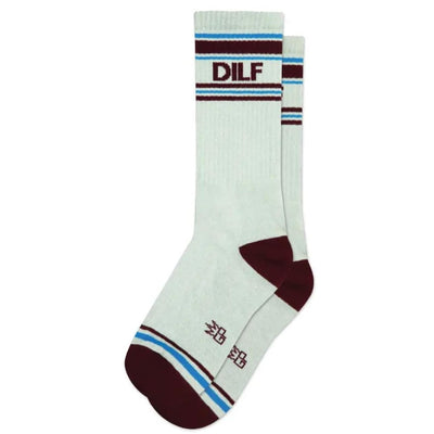 Gumball Poodle’s DILF Unisex Gym Crew Socks feature a white crew design with maroon toes, heels, stripes, and DILF at the top, plus blue accents, small maroon symbols by the toes, and wide ribbing for comfort.