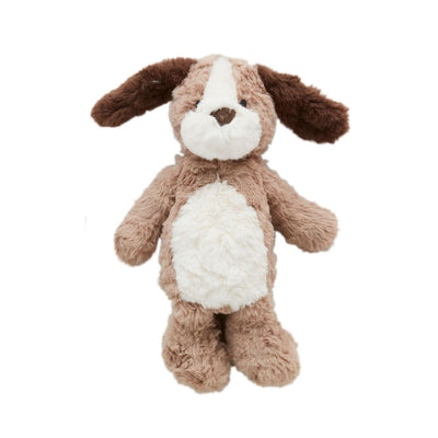 The Mud Pie Dog Plush is a faux fur stuffed animal shaped like a brown and white dog, featuring floppy ears, a fluffy tail, and a round belly with a weighted base for stability. It has a soft appearance and friendly expression against a plain white background.