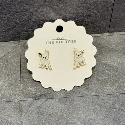 Frenchie Enamel Stud Earrings by Prep Obsessed Wholesale feature white French bulldogs with gold outlines, presented on a scalloped card labeled THE FIG TREE. A charming accessory for dog lovers and fans of cute fashion.