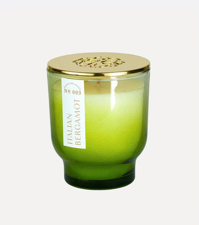 Feel energized with the Italian Bergamot 7 oz Maeve Glass Candle by Elum. Featuring an ombre glass holder transitioning from dark to light green and a gold lid, its crafted with Aura Pure technology for an uplifting scent that enhances any space.