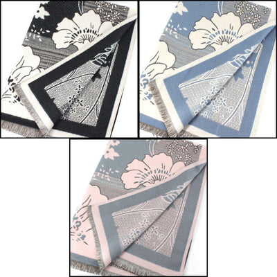Three Park Slope Reversible Patterned Scarves by Pretty Persuasions are shown in black, blue, and pink. Each 70"x25.5" polyester scarf displays front and back floral designs with fringe edging.