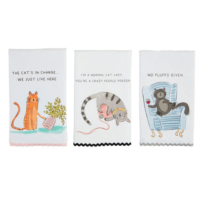 Mud Pie’s Cat Ric-Rac Towels are a set of three 26 x 16.5 100% cotton tea towels featuring cats with plants, yarn, or on a chair—each with a whimsical saying. Machine washable and beautifully illustrated.