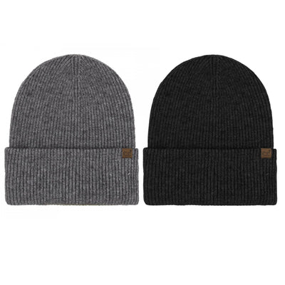 Two Judson & Company Long Folded Cuff Beanies—one gray, one black—made from a soft acrylic-polyester blend, are shown side by side on a white background, each featuring a small brown tag on the brim.