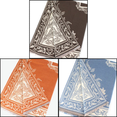 Three Pretty Persuasions Patterned Reversible Scarf/Shawls in brown, orange, and blue with white floral and geometric borders are shown in a grid. Made from 100% polyester, these stylish scarves are durable and versatile.