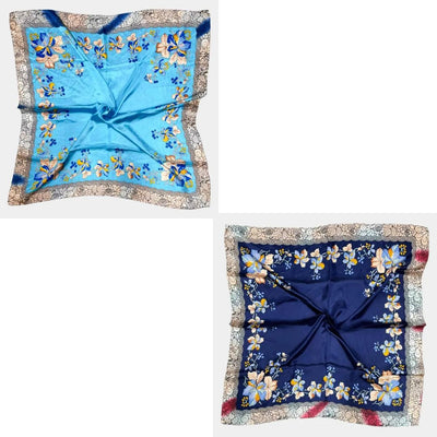 Two Sensibling Corp. Flower Pattern Printed Square Silky Satin Scarf Shawls are shown side by side: one light blue, the other dark blue, both with yellow flower motifs and beige borders in premium-quality satin.