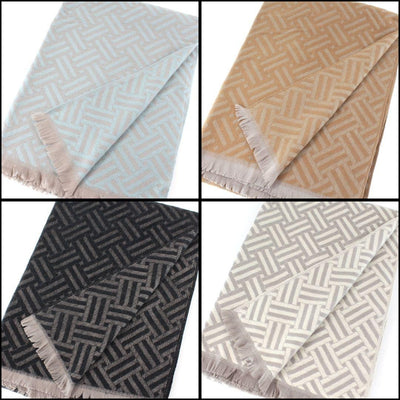Four Ingrid Reversible Scarves by Pretty Persuasions are shown in a grid. Made from 100% polyester with matching fringe, they feature a geometric pattern in light blue, tan, black, and light gray. Style S25361.